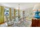 Bright dining room with a glass table, elegant chairs, and scenic views at 304 Bank St, Mount Pleasant, SC 29464