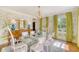 Elegant dining room with a glass table, and stylish buffet at 304 Bank St, Mount Pleasant, SC 29464