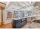 Spacious kitchen with a large island, stainless steel appliances, marble countertops and natural light at 304 Bank St, Mount Pleasant, SC 29464