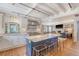 Spacious open kitchen featuring a center island with seating, marble countertops and hardwood floors at 304 Bank St, Mount Pleasant, SC 29464