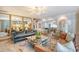 Open living room with modern chandelier, stylish decor, and doorway to an updated kitchen at 304 Bank St, Mount Pleasant, SC 29464