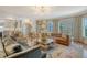 Inviting living room featuring stylish furniture, a fireplace, and seamless transition to the kitchen at 304 Bank St, Mount Pleasant, SC 29464