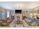 Bright and airy living room with comfortable seating, a fireplace, and a large window at 304 Bank St, Mount Pleasant, SC 29464