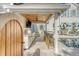 Outdoor kitchen with grill, bar seating, stainless steel appliances, and a view of the swimming pool at 304 Bank St, Mount Pleasant, SC 29464