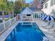 Outdoor pool and spa featuring a covered kitchen and bar area at 304 Bank St, Mount Pleasant, SC 29464