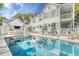 Backyard oasis with pool, outdoor kitchen and lounge area with umbrellas at 304 Bank St, Mount Pleasant, SC 29464