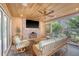 Inviting outdoor porch with comfortable seating, brick fireplace, and exterior views at 304 Bank St, Mount Pleasant, SC 29464