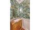 Stylish powder room with unique wallpaper, marble countertop, and elegant lighting at 304 Bank St, Mount Pleasant, SC 29464