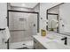 Modern bathroom featuring a glass-enclosed shower, vanity, and elegant decor at 305 Mayfield St, Summerville, SC 29485