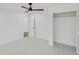 Spacious bedroom with neutral carpet, ceiling fan, and closet with louvered doors at 305 Mayfield St, Summerville, SC 29485