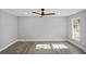 Bedroom featuring light-colored walls, wood flooring, and a ceiling fan at 305 Mayfield St, Summerville, SC 29485
