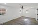 Bedroom featuring wood flooring, two windows offering natural light, and neutral paint at 305 Mayfield St, Summerville, SC 29485