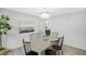 Bright dining room featuring modern light fixture, wainscoting, decor, and seating for six at 305 Mayfield St, Summerville, SC 29485
