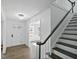 Inviting foyer with hardwood floors, staircase, and elegant chandelier lighting at 305 Mayfield St, Summerville, SC 29485