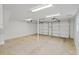 Spacious two-car garage with bright lighting and ample space for parking and storage at 305 Mayfield St, Summerville, SC 29485