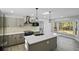 Modern kitchen boasts gray cabinets, stainless steel appliances, and stylish lighting at 305 Mayfield St, Summerville, SC 29485