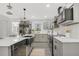 Modern kitchen with stainless steel appliances, shaker cabinets, and island at 305 Mayfield St, Summerville, SC 29485