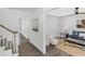 Bright living room is shown with a staircase, and an adjacent sitting area with contemporary decor at 305 Mayfield St, Summerville, SC 29485