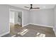 Living room featuring wood flooring, neutral colored walls and trim, and stairs to the second story at 305 Mayfield St, Summerville, SC 29485