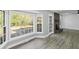 Bright living room with large bay windows and a fireplace with exposed brick at 305 Mayfield St, Summerville, SC 29485