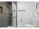 Modern bathroom shower with glass door, sleek black hardware, and tile surround at 305 Mayfield St, Summerville, SC 29485