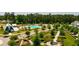 Aerial view of the community featuring a pool, barn, lush greenery, and a walking path for a serene neighborhood experience at 309 Archar St, Summerville, SC 29486