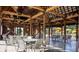 Open-air event space featuring sturdy wooden beams, ample seating, and scenic views of the surrounding area at 309 Archar St, Summerville, SC 29486