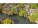 Aerial view showing property's prime location on the lake, as well as pool and surrounding neighborhood at 3176 Hagerty Dr, Charleston, SC 29414
