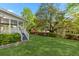 The lush backyard showcases the property's proximity to the lake and mature landscaping at 3176 Hagerty Dr, Charleston, SC 29414