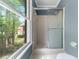 Bathroom featuring a shower with sliding glass doors and a view of the yard at 3176 Hagerty Dr, Charleston, SC 29414