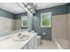 Bathroom showcasing a vanity, tub, and natural light from the window at 3176 Hagerty Dr, Charleston, SC 29414
