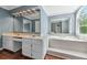 Bathroom with a double sink vanity, large mirror, soaking tub, and tile surround at 3176 Hagerty Dr, Charleston, SC 29414