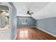Bedroom with hardwood floors, fan, window, and bathroom access at 3176 Hagerty Dr, Charleston, SC 29414