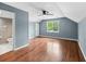 Bedroom with hardwood floors, a window, ceiling fan, and bathroom access at 3176 Hagerty Dr, Charleston, SC 29414