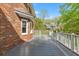 A spacious deck provides outdoor living with a view of a beautifully landscaped yard and neighboring house at 3176 Hagerty Dr, Charleston, SC 29414