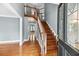 Inviting foyer with hardwood floors, staircase, and elegant trim detailing at 3176 Hagerty Dr, Charleston, SC 29414