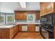 Functional kitchen featuring wood cabinets, modern appliances, and hardwood floors at 3176 Hagerty Dr, Charleston, SC 29414
