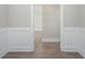 Hallway featuring modern wainscoting and a seamless transition between rooms at 334 Dahlia Row Dr, Summerville, SC 29486