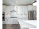 Bright kitchen featuring white cabinets, stainless steel appliances, and granite countertops under recessed lighting at 334 Dahlia Row Dr, Summerville, SC 29486