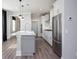 Bright kitchen with a central island, stainless steel appliances, and modern lighting fixtures adding a stylish touch at 334 Dahlia Row Dr, Summerville, SC 29486