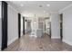 Open concept living room featuring a kitchen with stainless steel appliances and sleek countertops at 334 Dahlia Row Dr, Summerville, SC 29486
