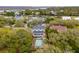 Aerial view of a neighborhood with lush trees and a pool, showcasing the community's charm and amenities at 3510 Myrtle St, Edisto Island, SC 29438