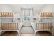Bedroom features two sets of bunkbeds and a ceiling fan at 3510 Myrtle St, Edisto Island, SC 29438