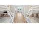 Bright bedroom featuring white bunk beds, neutral tones, and wood flooring at 3510 Myrtle St, Edisto Island, SC 29438