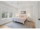 Inviting bedroom with large windows, ceiling fan, and light colored walls at 3510 Myrtle St, Edisto Island, SC 29438