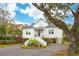 Charming two-story home with a classic design, featuring a cozy porch and beautiful curb appeal at 3510 Myrtle St, Edisto Island, SC 29438