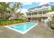 Well-manicured backyard with a pool and covered outdoor living area, perfect for enjoying the outdoors at 3510 Myrtle St, Edisto Island, SC 29438