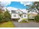 Charming two-story home with a classic design, featuring a cozy porch and beautiful landscaping at 3510 Myrtle St, Edisto Island, SC 29438