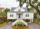 Charming two-story home with inviting front porch, manicured landscaping, and well-maintained exterior at 3510 Myrtle St, Edisto Island, SC 29438