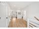 Bright hallway with wood floors and white doors at 3510 Myrtle St, Edisto Island, SC 29438